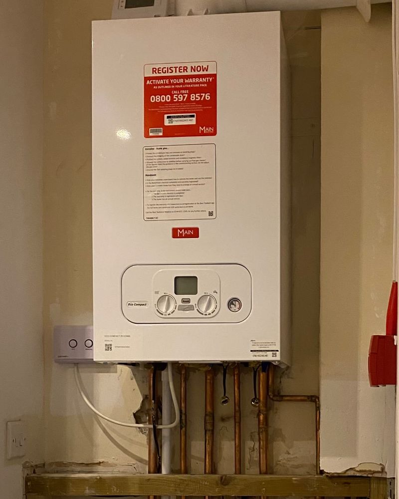 Newly installed combi boiler with copper pipework below